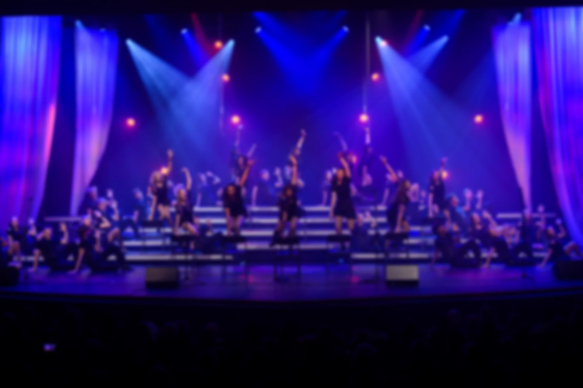 Live event stage with concert lighting produced by SPRK Productions