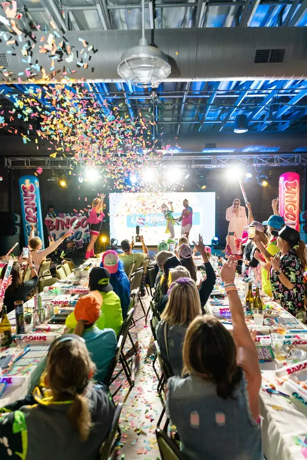 Corporate event lighting and confetti during a live program